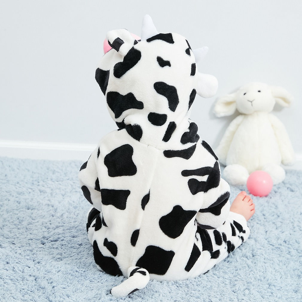 Cozy cotton baby pajamas with cute cow print, ideal for day and night wear.